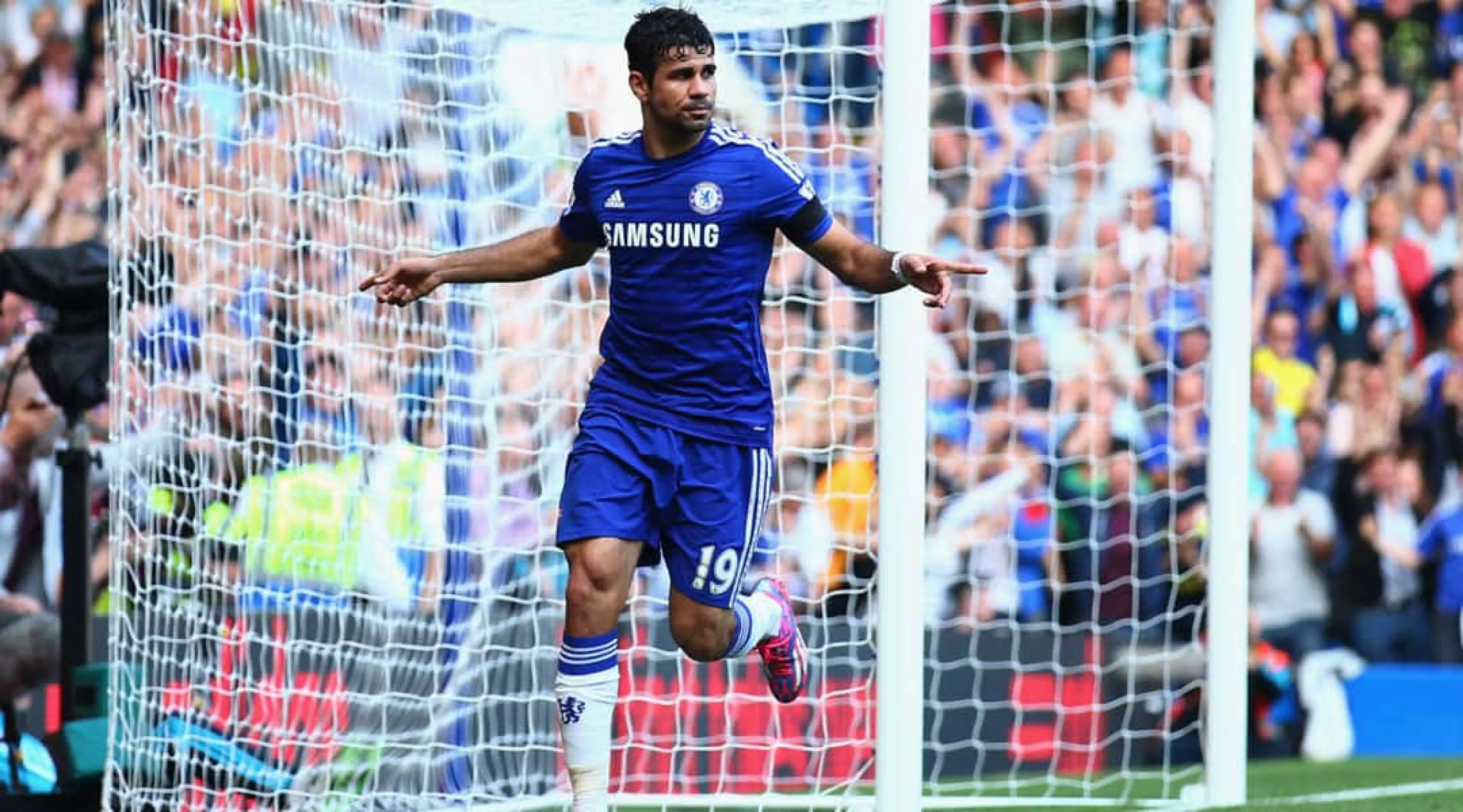Diego Costa celebrates scoring against Swansea in the Premier League