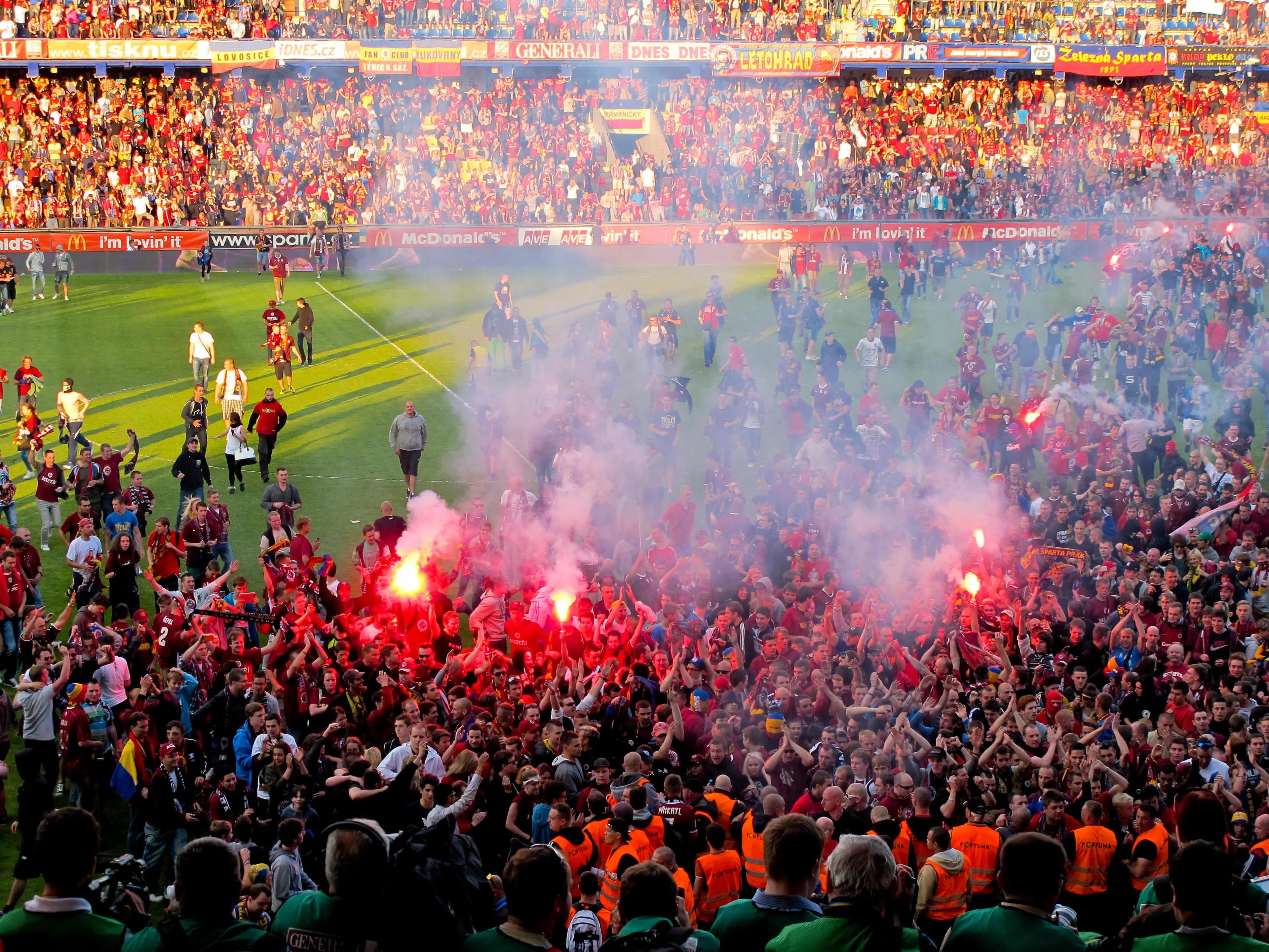 Sparta prague fans celebrating the victory and become champion of game while holding win coup