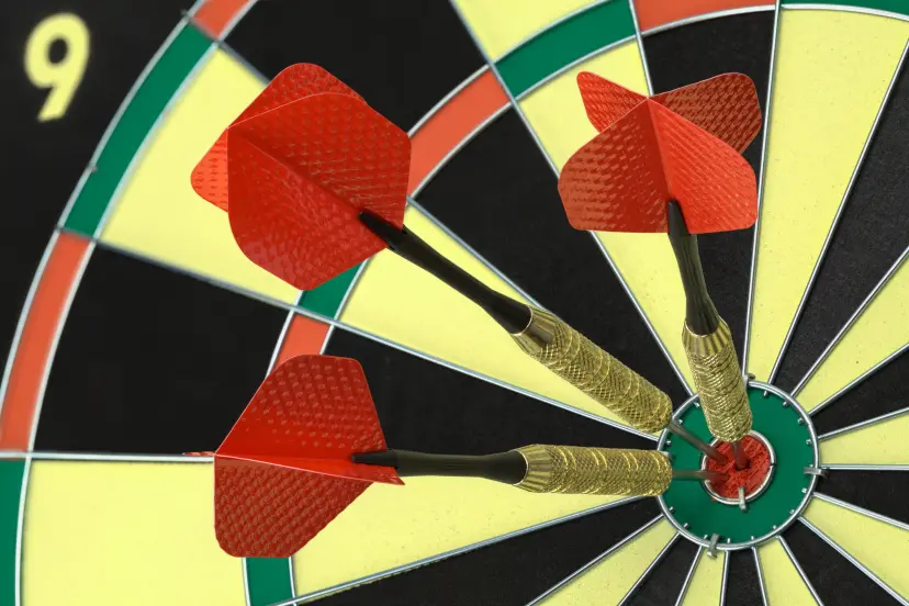 Three Darts in the Bullseye on Dart Board