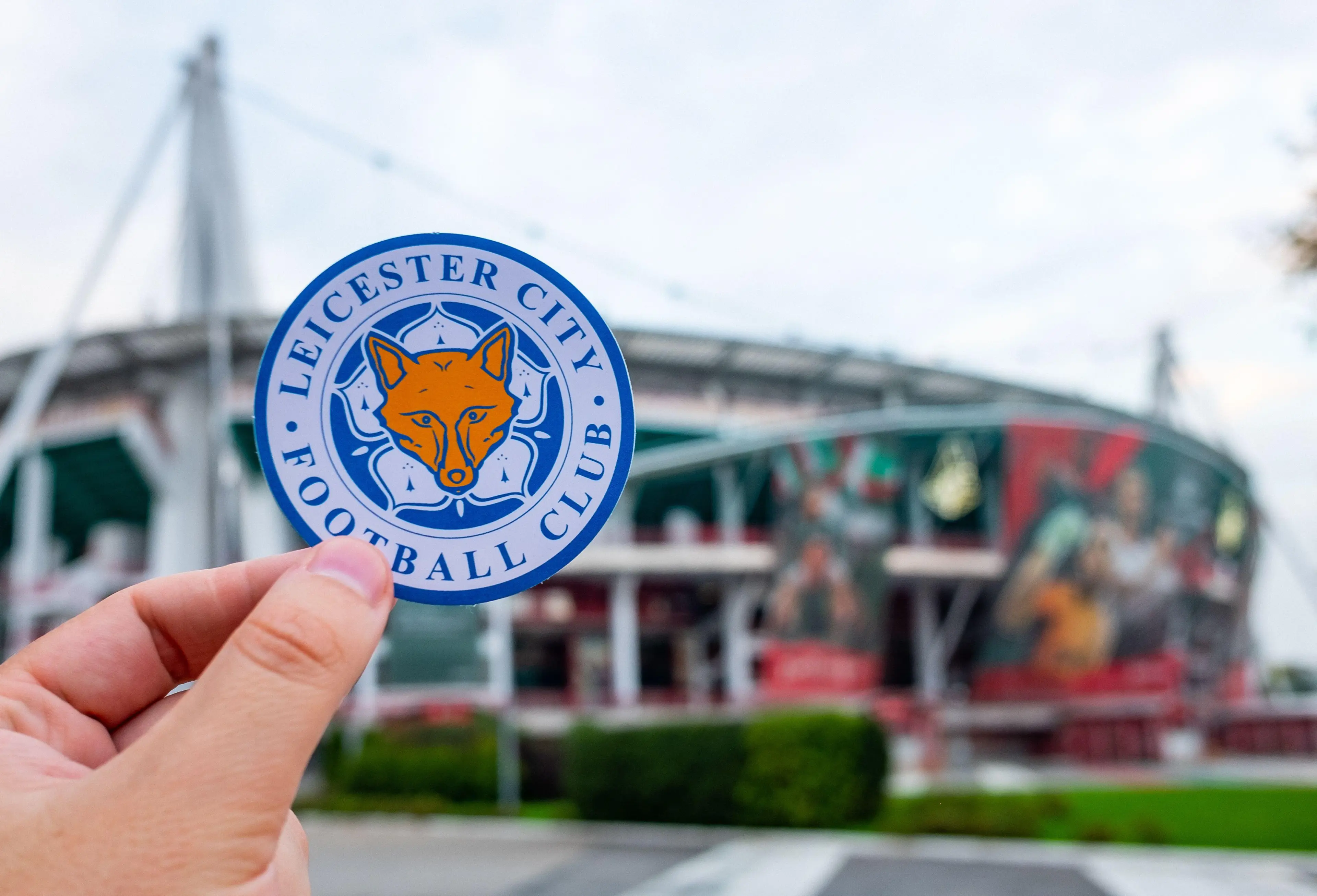 August 30, 2021, Leicester, UK. Leicester City F.C. Football Club emblem against the backdrop of a modern stadium