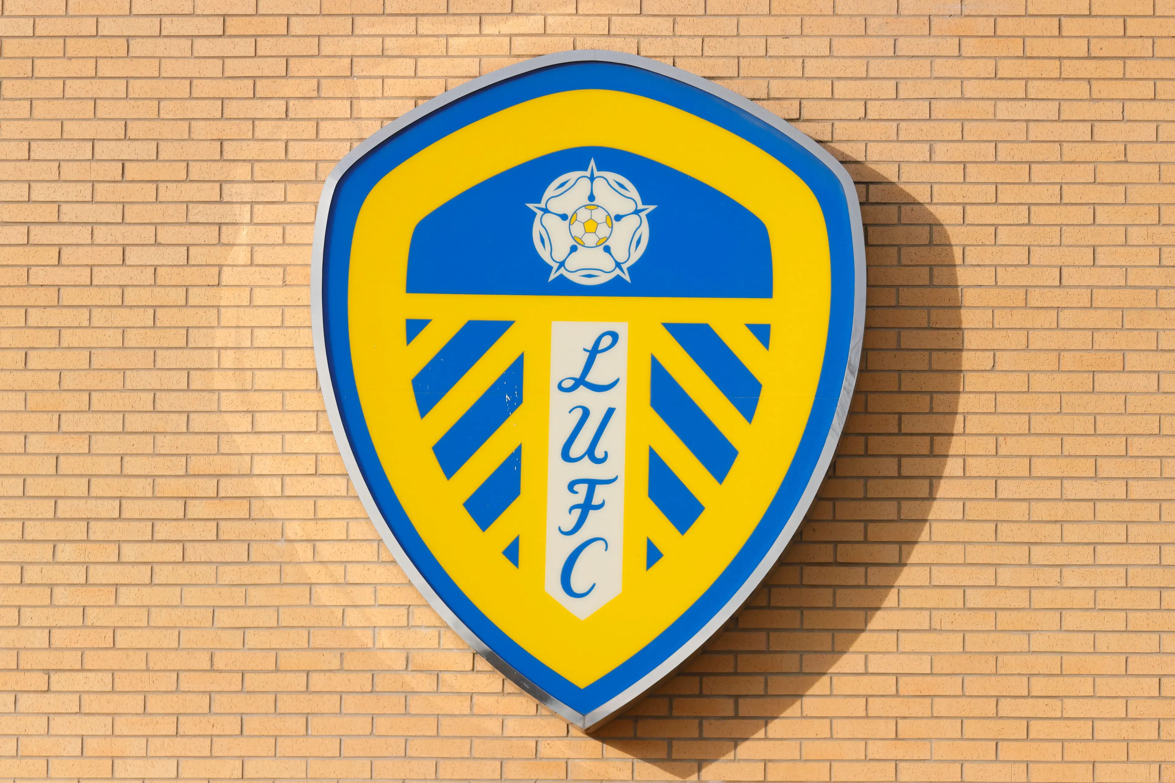 Leeds United's team logo mounted on the exterior of Elland Road Stadium in Leeds,West Yorkshire