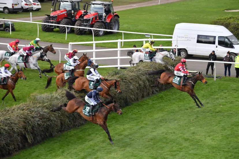 Liverpool, UK, 12th Apr, 2024. The leaders jump the third in The Grand National at Aintree