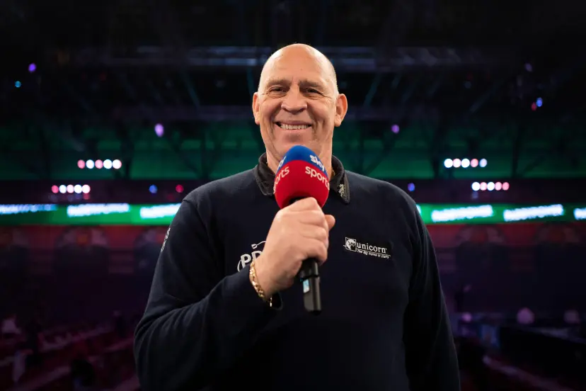 Russ Bray poses for photos on day six of the Paddy Power World Darts Championship