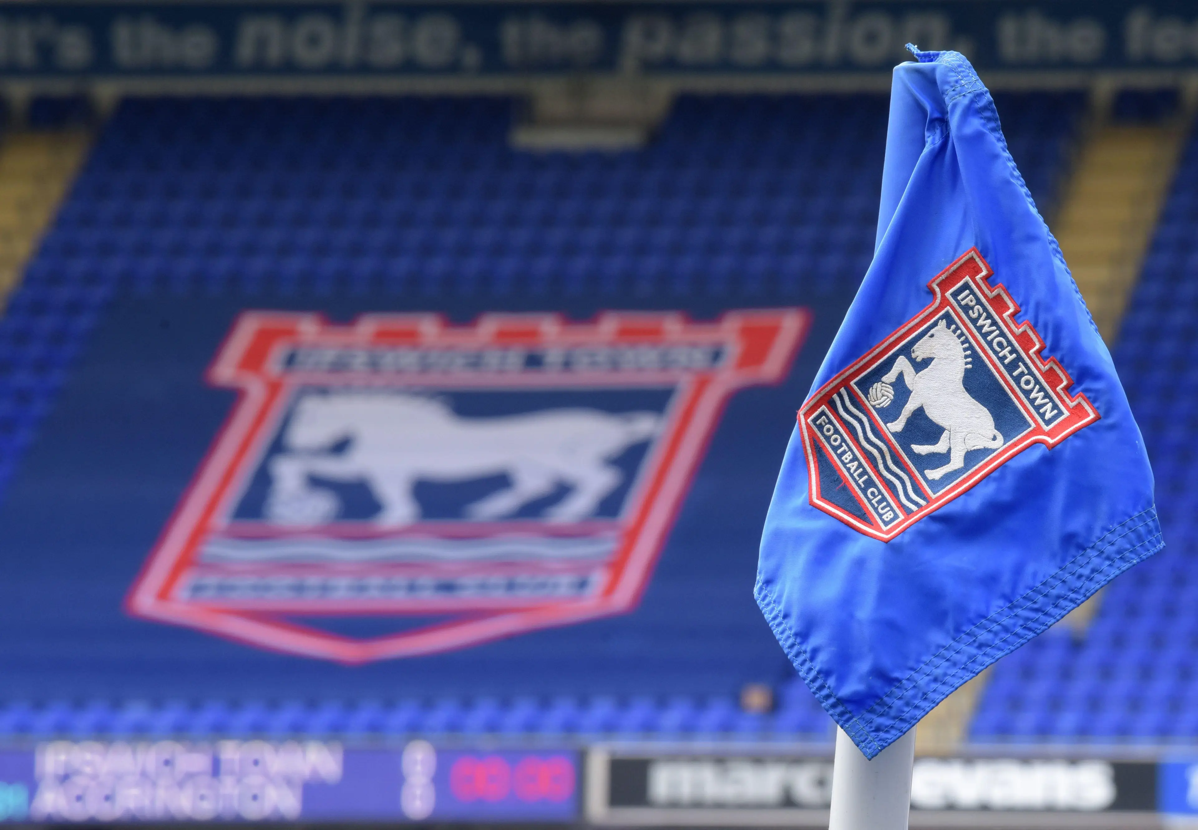 Ipswich Town corner flag and club badge is seen over the seats in the Sir Bobby Robson Stand